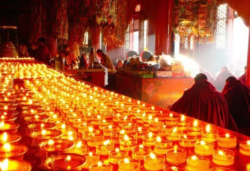 Rows of butter lamps burning inside the Jokhang Temple, Lhasa